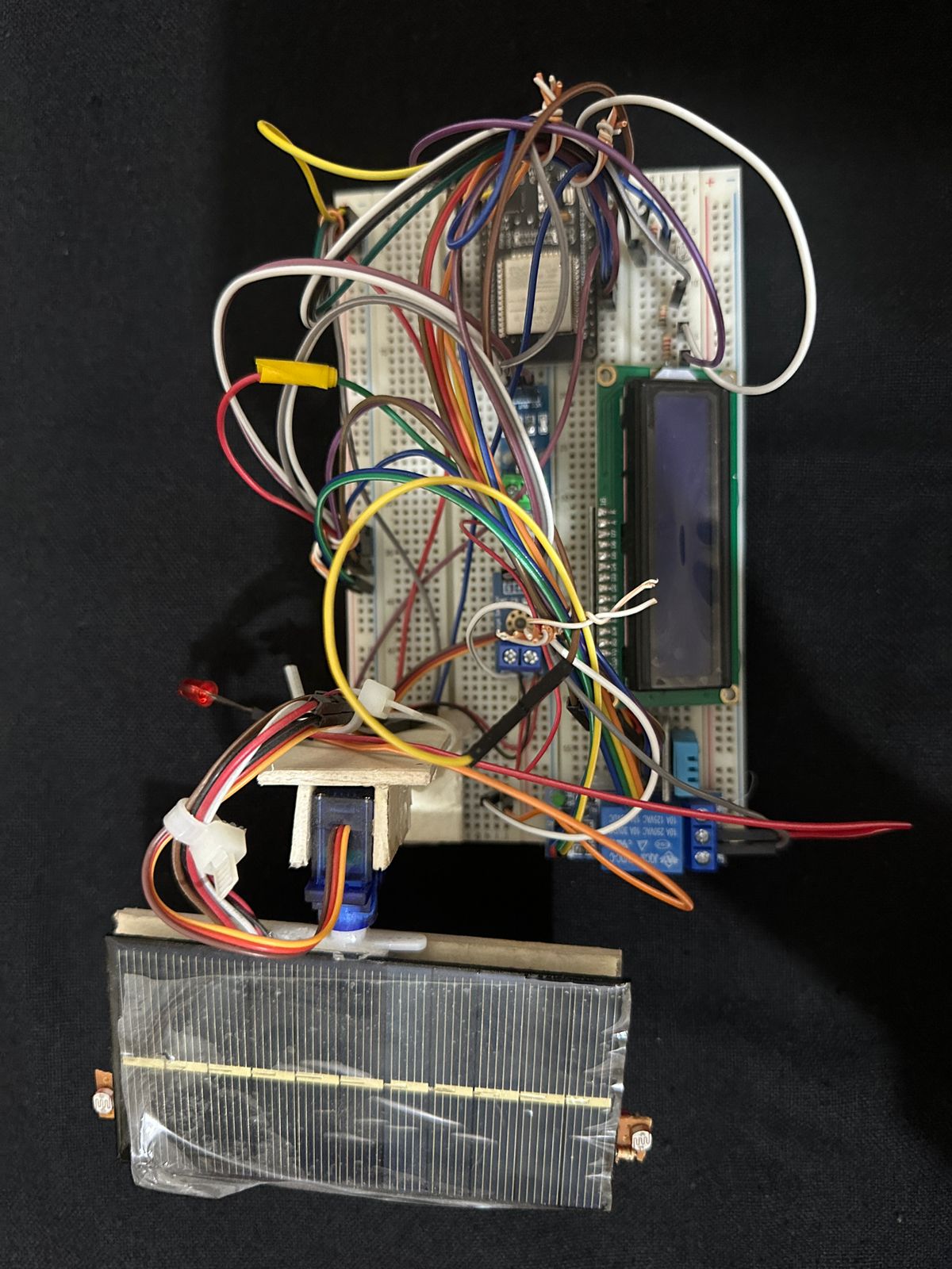 Design of an Internet of Things based Hysteresis Control system in a Photovoltaic Panel Controller for the Smart use of Solar Electric Energy in Rural Areas
